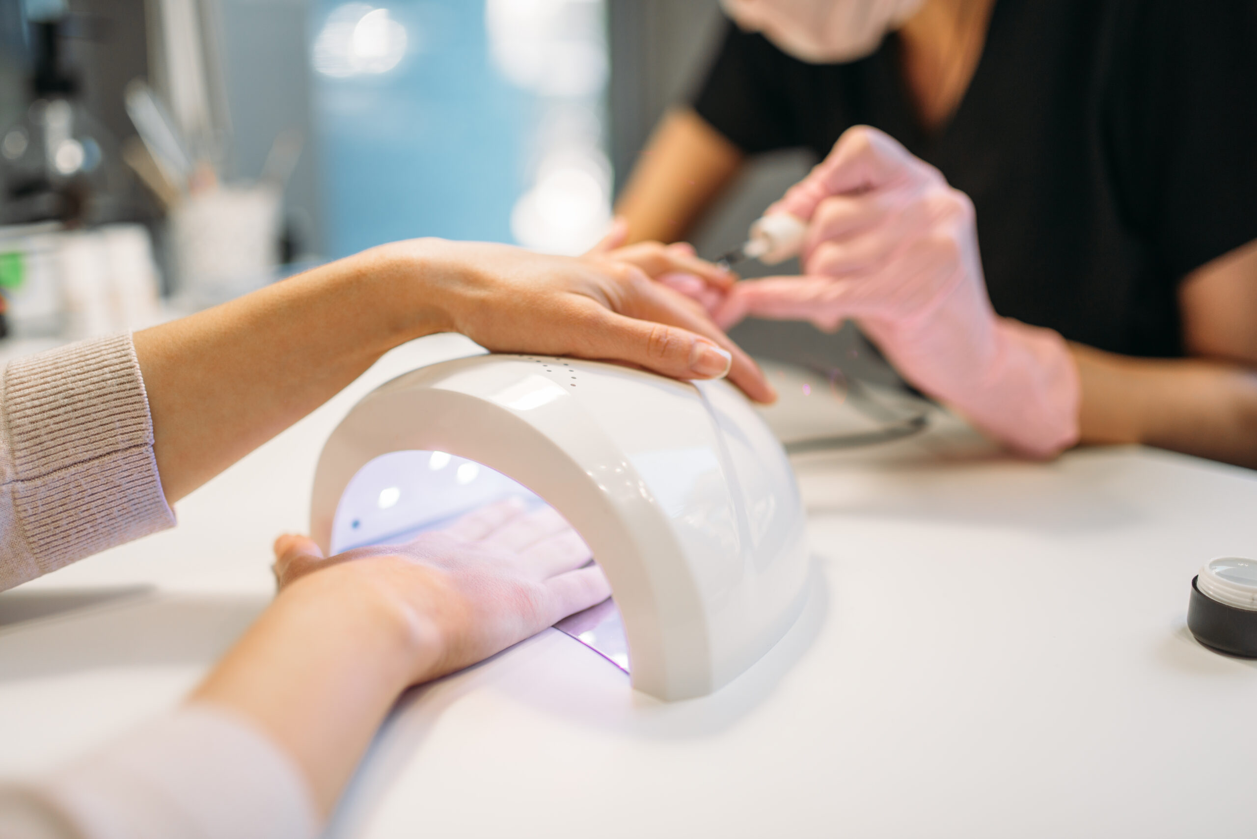 female client dries gel varnish in the nail dryer 2023 11 27 04 49 33 utc scaled