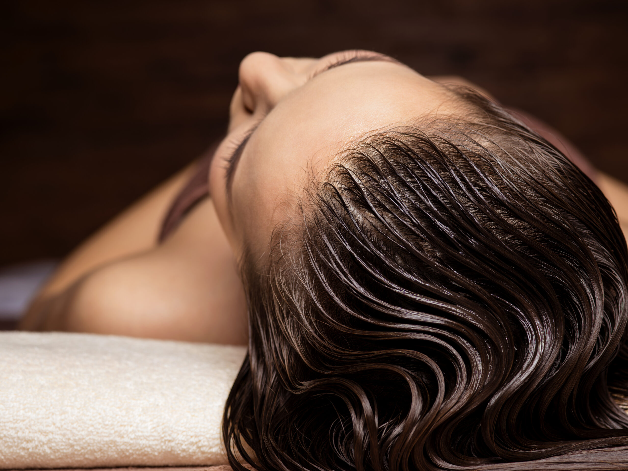 woman receiving hair care procedure in spa salon 2023 11 27 05 04 30 utc scaled